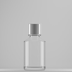 The image you sent is a stock photo of a small, clear glass bottle with a silver lid. It is sitting on a plain gray background. This type of bottle is often used to contain cosmetic serums or other 