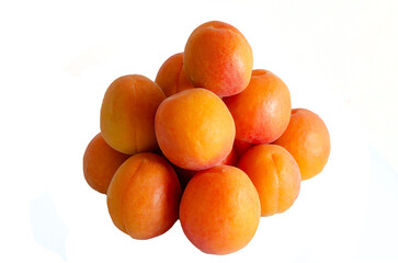 Yellow apricots on a white background close-up