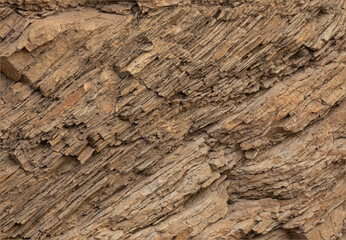 Layered sand coloured stone textures background