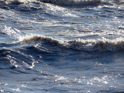Sunlight sparkling on ocean waves.