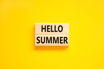 Hello summer symbol. Concept words Hello summer on beautiful wooden block. Beautiful yellow paper background. Business lifestyle Hello summer concept. Copy space.