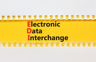 EDI electronic data interchange symbol. Concept words EDI electronic data interchange on yellow paper. Beautiful white background. Business and EDI electronic data interchange concept. Copy space.