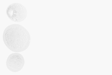 drops of cosmetic foam texture on light background