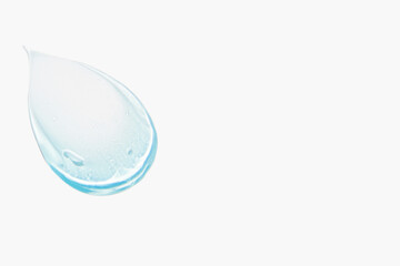 Smears of cosmetic texture of blue gel on a light background