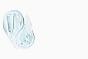 Smears of cosmetic texture of blue gel on a light background