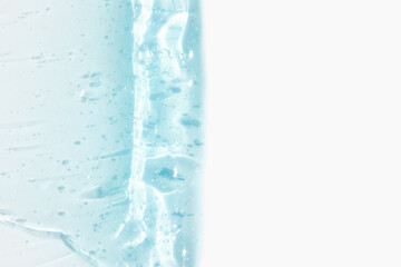 Smears of cosmetic texture of blue gel on a light background