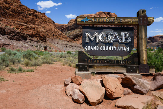 Moab, UT, USA - June 11, 2024; Welcome sign in landscape to Moab Grant County Utah  with red rocks