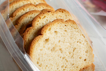 A view of an opened package of gluten-free bread slices.