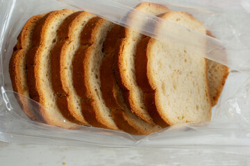 A top down view of an opened package of gluten-free bread slices.