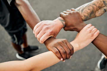 Friends, holding hands and solidarity for workout, outdoor and fitness of group and happy for routine and above. Morning, closeup and collaboration of team, runner and exercise for summer body