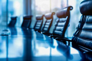 Creative photo of a large meeting table and empty office chairs for the board of directors.