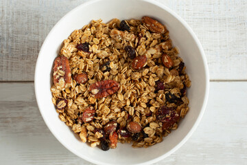 A top down view of a bowl of granola cereal.