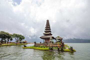 Pura Ulun Danu Bratan, Hindu temple on a lake, with gardens and boats in Bali, Indonesia.