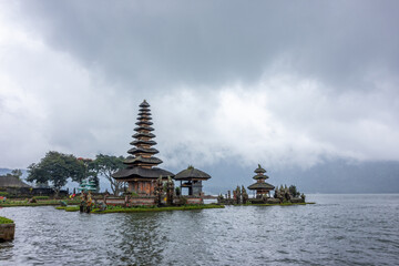 Pura Ulun Danu Bratan, Hindu temple on a lake, with gardens and boats in Bali, Indonesia.