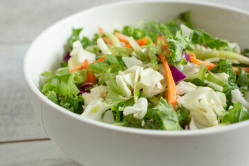 A closeup view of a chopped salad bowl.
