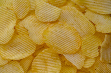 Potato chips texture background flat overhead view