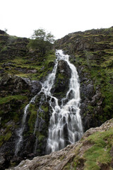Slow shutter speed photograph of Moss force waterfall in the Lake District of England.