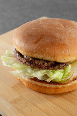 A closeup view of a quarter pound hamburger.