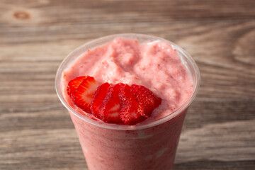 A closeup view of a strawberry smoothie.