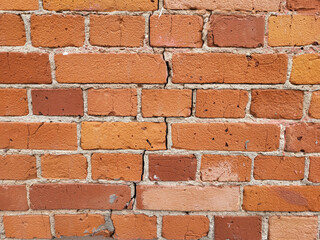 The background of the wall is made of antique red brick