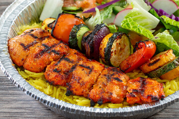 A view of a chicken kebab entree.