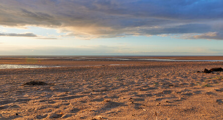 Deserted beach at low tide