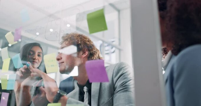 Glass, training and writing with business people in office for brainstorming a strategy together. Collaboration, teaching or workshop with man and woman employee team in workplace for problem solving