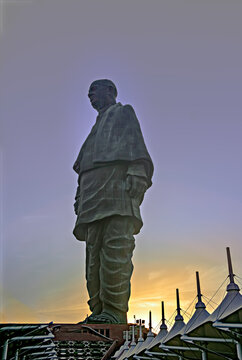 Silhouette full image of Worlds tallest statue known as Statue of unity with beautiful sunset sky background in Kevadia, India.