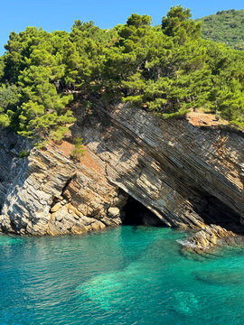 Blue turquoise sea and layered rocks