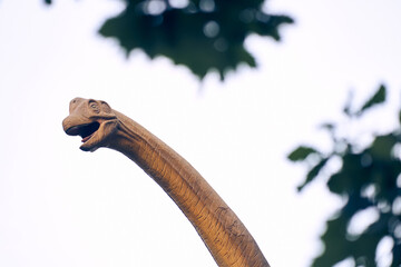 The head of a brachiosaurus is against the sky. The sauropod dinosaur is one of the largest and most popular. He lived at the end of the Jurassic period. With a place to copy. High quality photo © daryakomarova