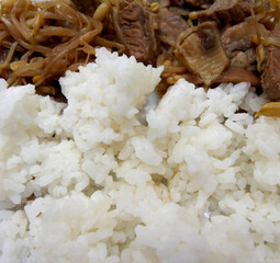 White rice with mushrooms. meal details. food with selective focus. rice accompanied by bean sprouts and mushrooms.