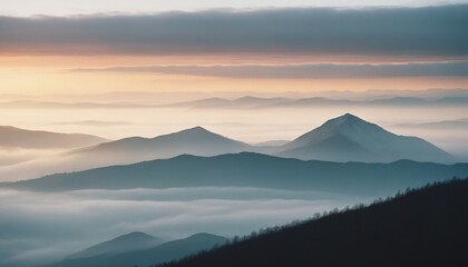 mountain layers and sunrise view in cold and foggy weather.