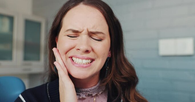 Woman, pain and cavity with dental surgery in clinic for teeth removal or oral extraction and treatment. Female person, dentistry and toothache in consultation or checkup for root canal procedure
