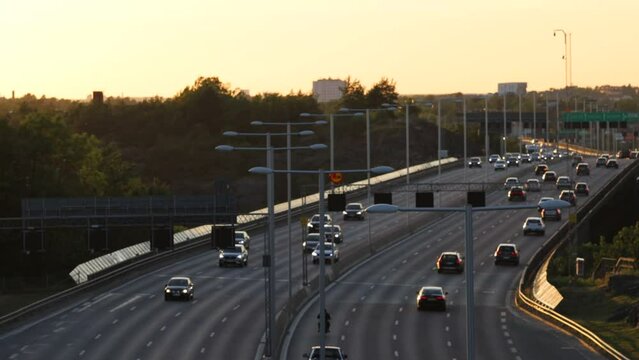 Stockholm, Sweden Traffic at sunset on the E4 highway or Essingleden.