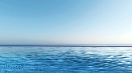 Fototapeta premium A luxurious infinity pool overlooking a serene ocean, with the water reflecting the clear blue sky