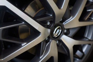 Closeup of a modern car wheel with alloy rims showcasing stylish design and craftsmanship