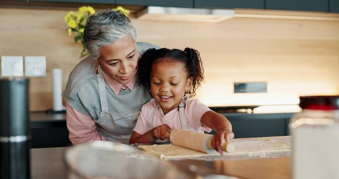 Child, grandmother and baking in kitchen in home, bonding and teaching culinary skills with family in house. Happy, education and rolling dough on table, woman and development or help in apartment