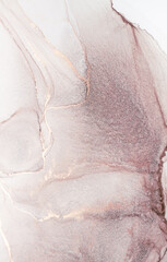 A close-up abstract painting featuring pink and gold hues, showcasing the flowing and swirling...