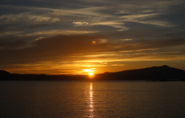 Dramatic cloud sky over the sea during sunset. 