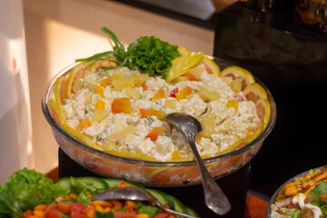 fresh russian salad topped with oranges fruits and green leaves