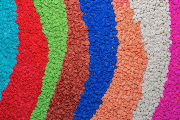 Creative striped mosaic made of colorful tissue paper rolled into small balls. Rainbow papercraft