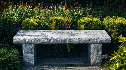 An outdoor marble bench in a landscaped garden
