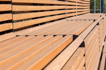 wooden sports stands , benches in the outdoor park closeup