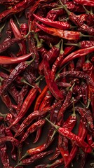 Dried red chili peppers on a wooden surface, spicy food ingredient concept