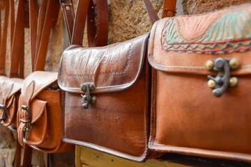 Traditional Handbags in leather handmade for sale in street markets at India.