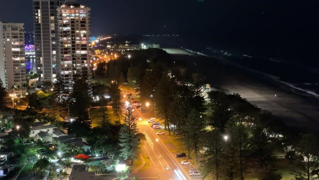 Time lapse, Gold Coast, Main Beach, Night shot, nighttime cityscape, coastal view, urban beach, high-rise buildings at night, illuminated streets, ocean view at night, Australia, Queensland