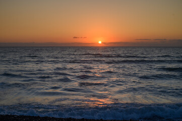 Sun rise at the beach. Sun rising at sea horizon. Golden hour.