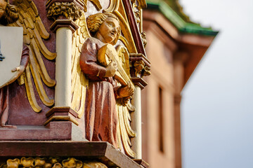 A large, ornate building with a gold and red color scheme