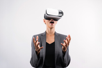 Business woman holding something while wearing VR goggle and standing at white background. Project manager with headset enter visual reality world program by using technology innovation. Contraption.