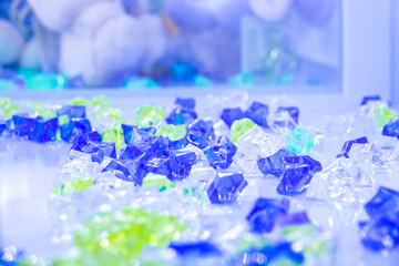 A pile of blue, green, and white gems